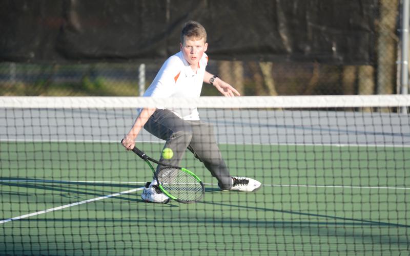 Sunshot by Grayson Williams - Hart County’s No. 2 singles player, Michael Floyd, returns a volley on March 6 at Hart County High School.