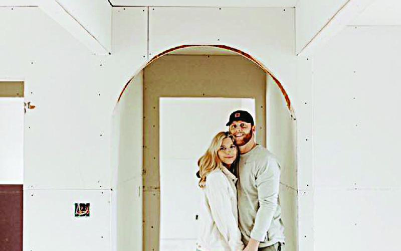 Maggie and John Vollrath pose for a photo during renovations at the Athens Street house.  Photo  submitted