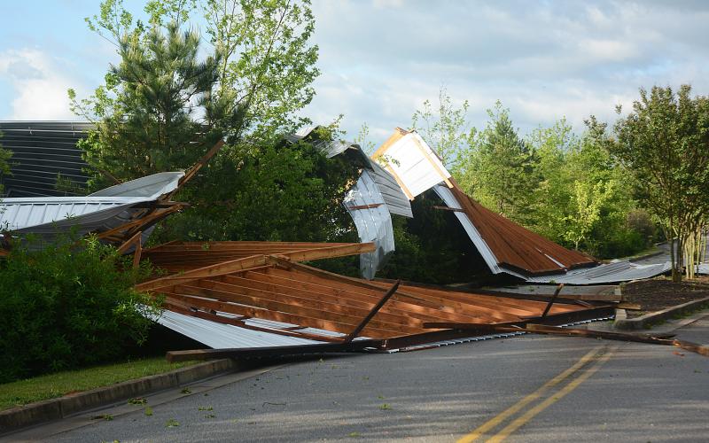 Sunshot by Michael Hall — The roof of a boat storage building was blown off its structure and into the entrance of the Hart County Parks and Recreation Department park on Elberton Highway early Monday.
