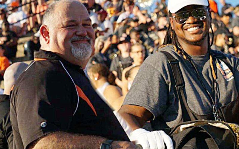 Photo submitted — Hart County High School band director Alan Tolbert, left, poses for a photo during a band competition with Rendarris Gaines, a recent HCHS graduate who recalls Tolbert as his favorite teacher.