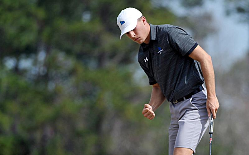 Hart County High School graduate Eli Scott celebrates sinking a putt during his freshman year at College of Coastal Georgia in Brunswick.  Derrick Davis/The Brunswick News