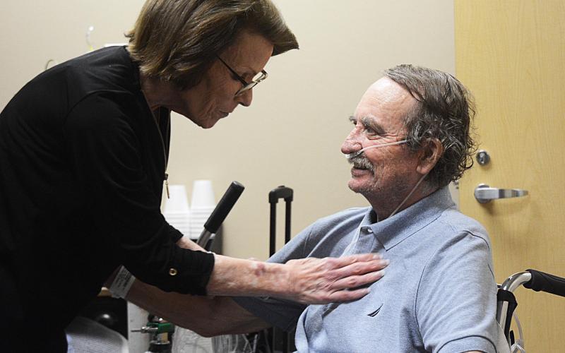 Sunshot by Michael Hall — Hartwell resident Sally Frady, left, sees her husband Richard Frady, right, for only the third time in two months after Richard Frady spent 64 days in the hospital battling COVID-19.