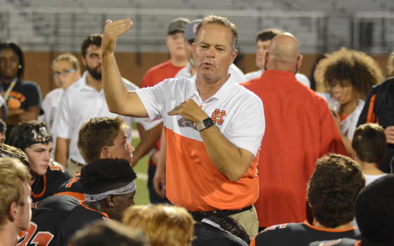 Hart County High School head football coach and athletic director, Rance Gillespie, talks to the Bulldog football team during a game against Jackson County in 2019.