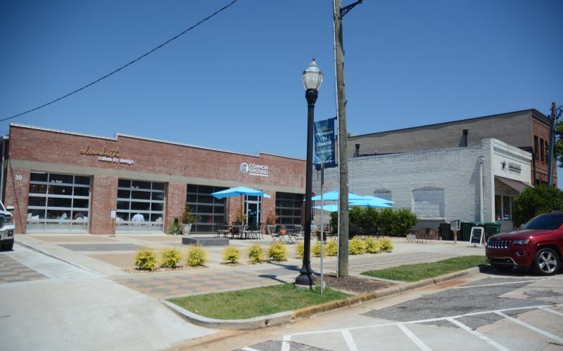 Sunshot by Michael Hall — Elizabeth Cakes by Design, left, Common Ground, middle and the Hart County Chamber of Commerce, right, are shown on Carolina Street in downtown Hartwell recently. A block party is scheduled for July 22 for those and other new businesses on the street.