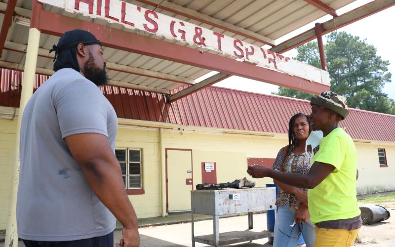 Sunshot by Grayson Williams — Pastor Frederick Vehe, left, Keesha Oglesby, center and Darlene Smith-Neal talk about their plans outside of the vacant G&amp;T Snack Bar recently.