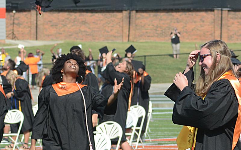 Shaniya Blackwell throws her cap with the rest of the Class of 2020 following the ceremony.