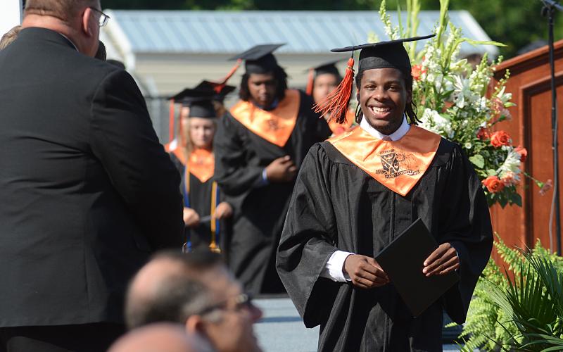 Sunshots by Michael Hall Jabriel Martin grins from ear to ear after receiving his diploma Saturday, July 18, at Hart County High School during the pandemic-postponed graduation ceremony.