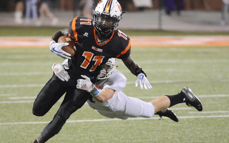 Sunshot from file — Paul Davis tries to shed a Jackson County tackler in 2019.