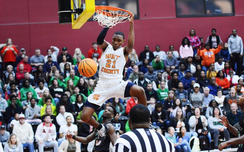 Sunshot from file — Hart County basketball player Shone Webb dunks during a Region 8-AAA tournament game in February.