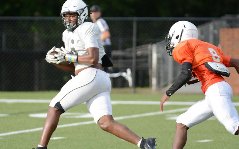 Sunshot by Grayson Williams - Receiver Malachi Kelley looks for running room up field after making a catch during the Bulldogs’ intrasquad scrimmage on Aug. 21 at Herndon Stadium.