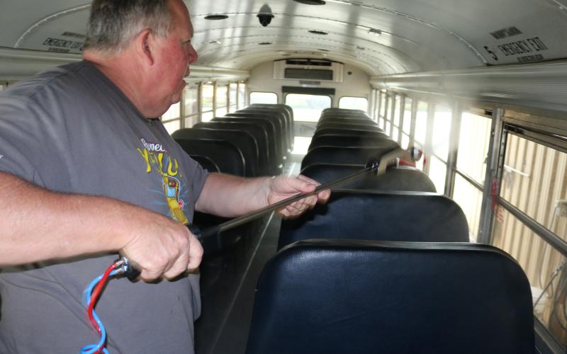 Sunshot by Grayson Williams — Jeff Garner, Hart County Charter System transportation director, shows how a disinfecting fogger works that will be used to sanitize buses during the school year.