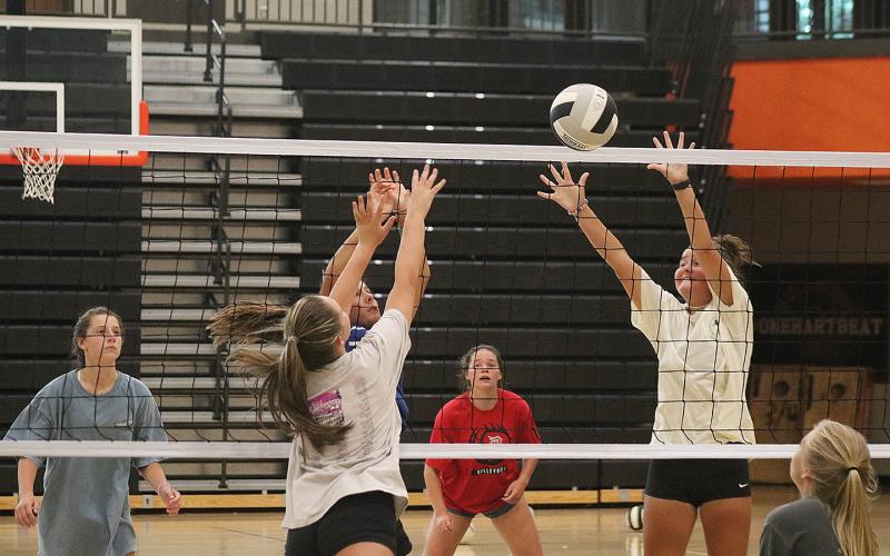 Sunshot by Grayson Williams — The Hart County volleyball team practices at the gym at Hart County High School on Monday, Aug. 3. The team is eyeing a deeper playoff run this season.