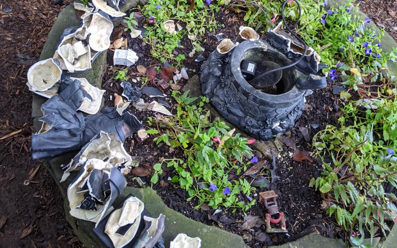 Photo submitted - A fountain in the Anne King Garden at the Hart County Botanical Garden is shown in pieces after recent vandalism.