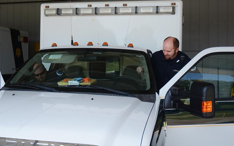 Sunshot by Michael Hall - Paramedic T.J. Brister climbs into the driver’s seat of an ambulance to head out to a call last week at the Hart County EMS headquarters.