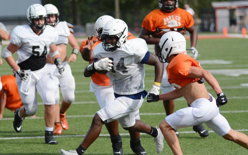Sunshot by Michael Hall - Hart County running back J.L. Lackey finds a hole to score a touchdown on Friday, Aug. 28 during an intrasquad scrimmage at Herndon Stadium at Hart County High School. The Bulldogs are set to open their season on Friday, Sept. 4, at Wayne County at 7:30 p.m. following a COVID-19 cancellation of the Elbert County game.