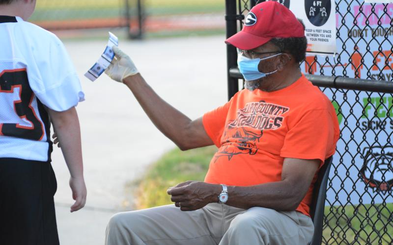 Sunshot by Grayson Williams Joel Gaines, right, spent more than 30 years as a Hartwell Police Officer. Today he is loving life while volunteering to take tickets at Hart County football games, among other things.
