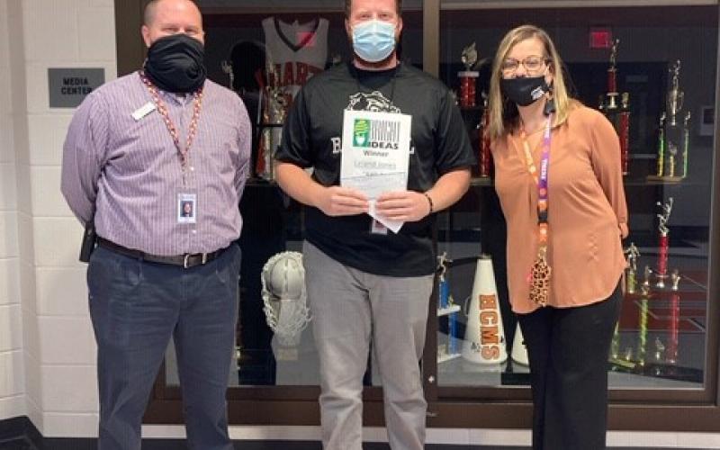 Photo submitted HCMS teacher and Bright Ideas grand winner Leland Jones, middle, is shown with Trae Jones and Principal Jacqueline Brock.