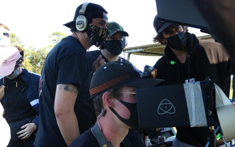Sunshot by Grayson Williams The crew of “The Green,” a television pilot being filmed at Cateechee in Hartwell this week film a scene at the golf course on Tuesday, Sept. 22. Pictured are Wesley Cox, left, Justin Sterner, middle back, James McShane, right, and McKinley Benson, bottom.