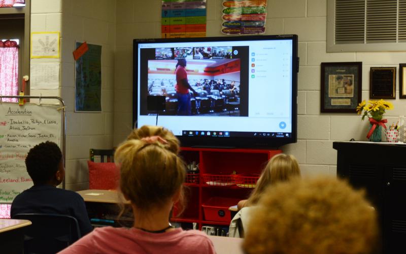 Natali Villegas asks a question to University of Georgia football players during a Zoom call on Tuesday, Sept. 29, at South Hart Elementary.