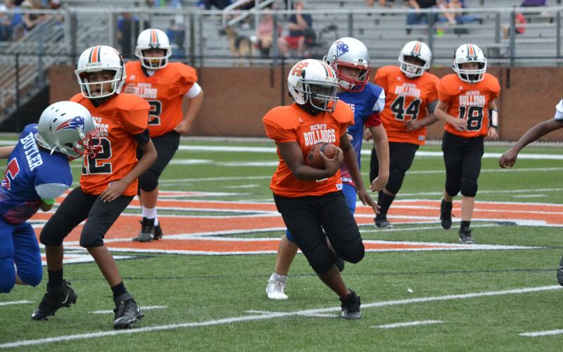 Bryshun Jordan looks for the path past Oglethorpe County defenders in Hart’s win in the 11U game.