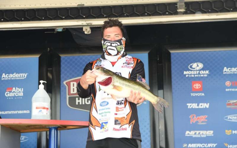 Photo submitted - Dawson Carden shows off the second-biggest fish of the tournament, a 5-lbs., 6-oz., largemouth at weigh in of the Mossy Oak Fishing Bassmaster High School Series.