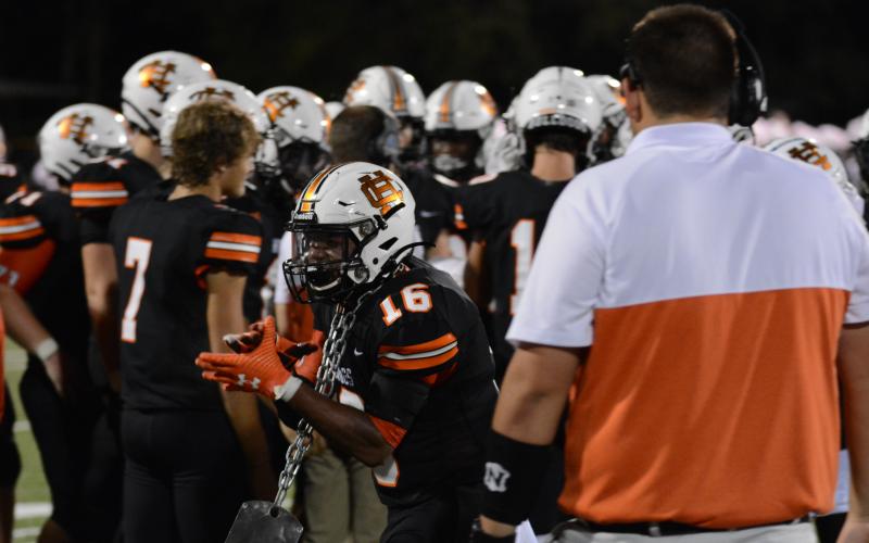Rod Morrison celebrates with the turnover dog tag after recovering a fumble against White County.
