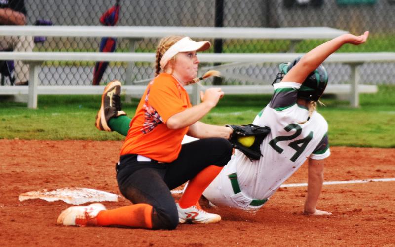 hoto by Shane Scoggins/Franklin Co. Citizen-Leader - Gabby Buffington tags a Franklin County base runner at third base on Sept. 24 in Carnesville.