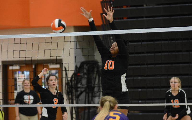 Sunshot by Grayson Williams Taniyah Alexander goes for a block against Athens Christian Sept. 17 at Hart County High School.