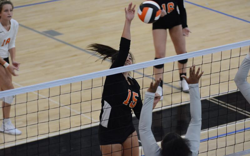 Sunshot by Grayson Williams - Olivia Morris spikes the ball against Monroe Area at Hart County High School on Tuesday.
