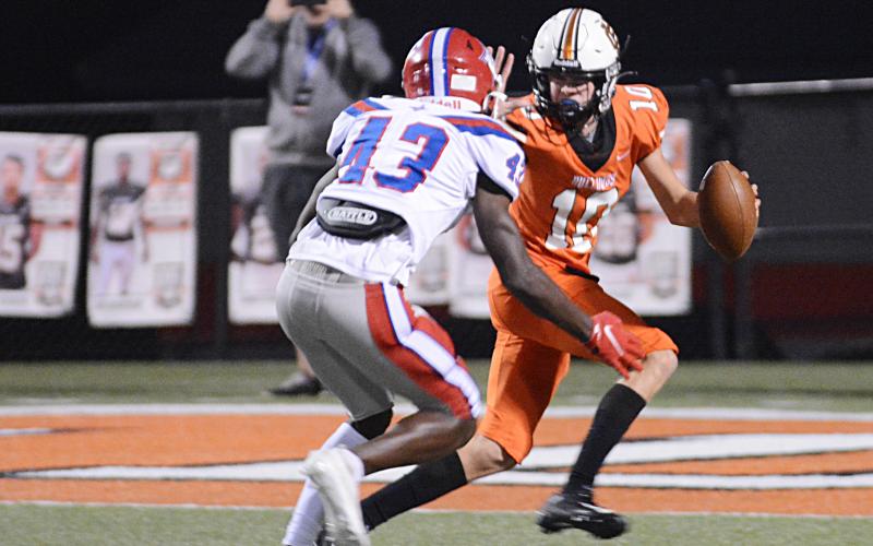 Sunshot by Michael Hall Quarterback Tanner Ayers tries to elude a Jefferson defender on Friday, Oct. 2, at Herndon Stadium in the Bulldogs’ 26-19 loss.