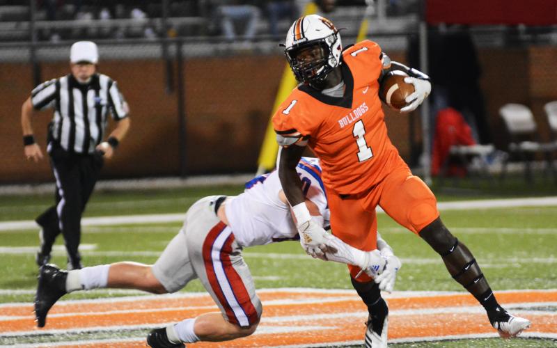 Sunshot by Michael Hall Malachi Thomas tries to shake a tackler on Friday, Oct. 2, at Herndon Stadium in the Bulldogs’ 26-19 loss to Jefferson