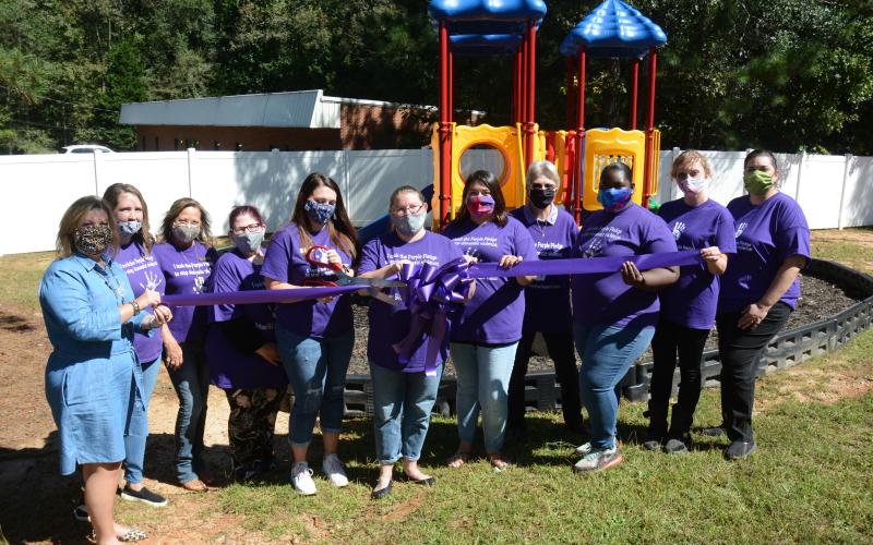 Sunshot by Michael Hall - Pictured from left to right are Teresa Neese (board president), Taylor Burnett, Tina Sosebee, Tiffany Holland, Kristen Jackson, Barbara Stowe, Isabel Bocanegra, Katherine Reusing (executive director), Tekara Rucker, Mallory Rowland and Joanna Fleming.