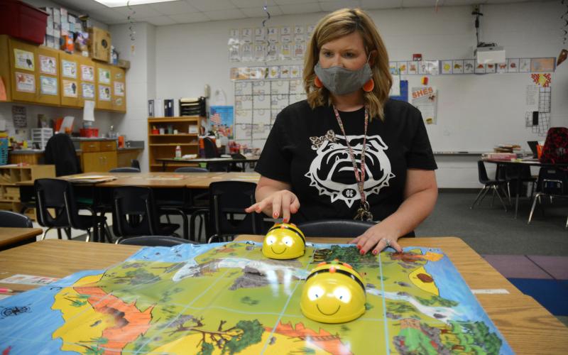 Sunshot by Michael Hall - Sommer Morris shows how to program Bee-Bots at South Hart Elementary recently. The bots were purchased using money she earned through a Hart EMC Bright Ideas Grant.
