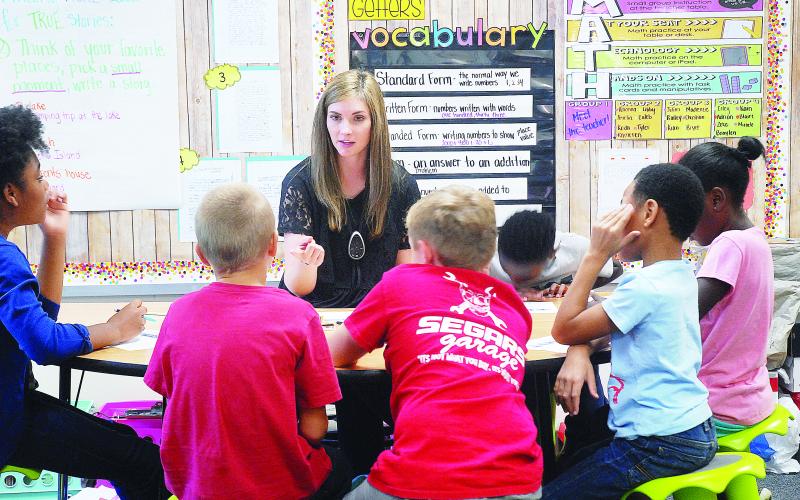 Sunshot from file - Andrea Gibbs works with students in her class in 2018 at Hartwell Elementary.