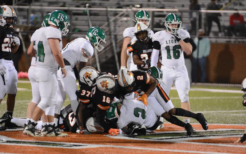 The Hart County defense takes down a Franklin County ball carrier on Friday, Oct. 15, at Herndon Stadium in the Bulldgogs’ Homecoming night win.