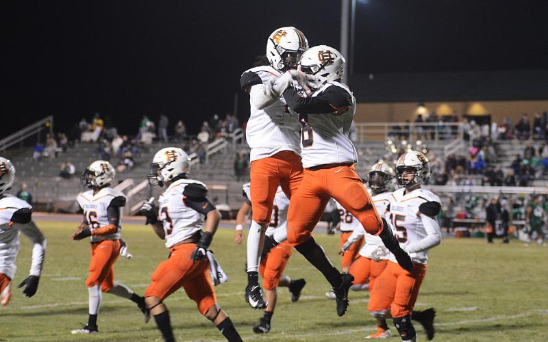 Players celebrate a big play in the 2019 win by the Bulldogs over the Franklin County Lions. The two teams will meet for this year's game on Friday, Oct. 16.