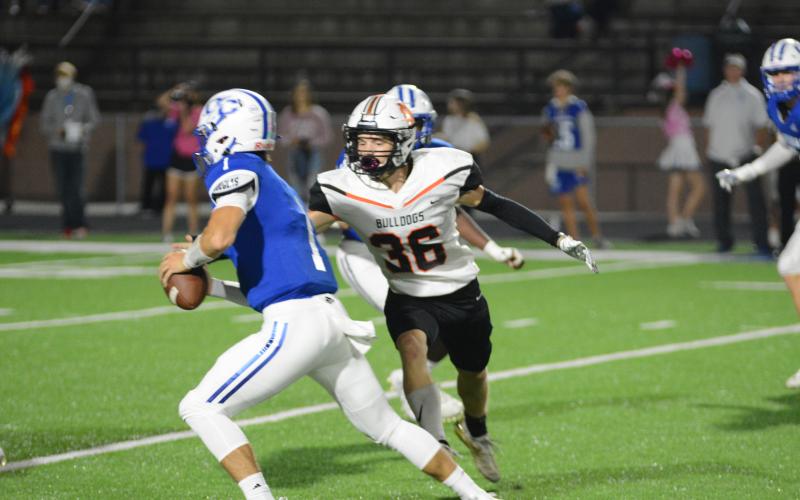Sunshots by Grayson Williams - Hart County’s Levi Lystiuk tries to corral the Oconee County quarterback in the Bulldogs’ loss in Watkinsville on Oct. 23.