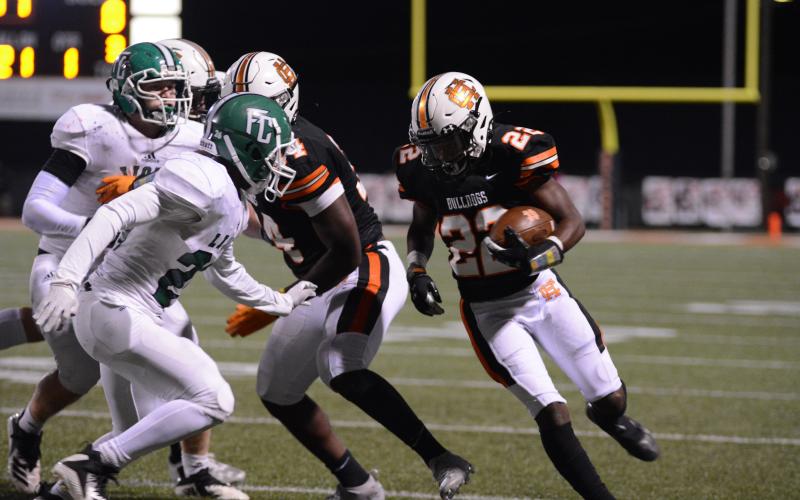 Sunshots by Grayson Williams Running back Nori Moore prepares for contact with a Franklin County defender on Friday, Oct. 16, at Herndon Stadium in the Bulldogs’ homecoming victory over the Lions.