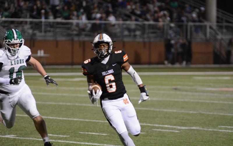 Malachi Kelley runs with the football against Franklin County on Oct. 16, at Herndon Stadium.