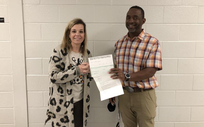 Pictured are seventh-grade math teacher at Hart County Middle School, Tommy Hughes, and principal Jacqueline Brock accepting the grant on behalf of the STEAM committee.