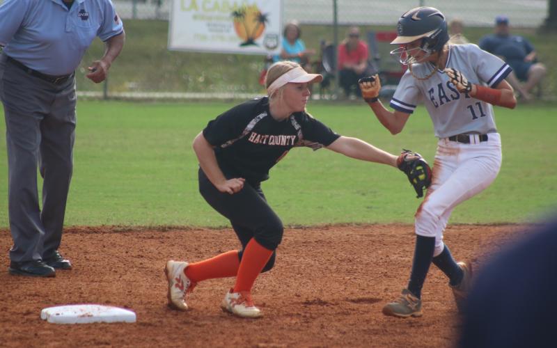 Sunshots by Grayson Williams Gabby Buffington tags an East Jackson runner out during the Lady Diamond Dogs’ victory in the Region 8-AAA tournament on Monday.