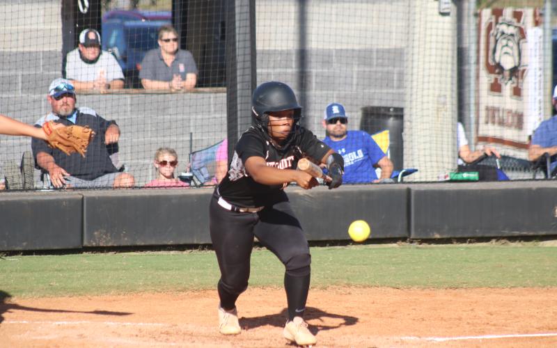 Sunshot by Grayson Williams Zoe Brock bunts during a Sweet 16 matchup between Hart County and Ringgold on Oct. 23.