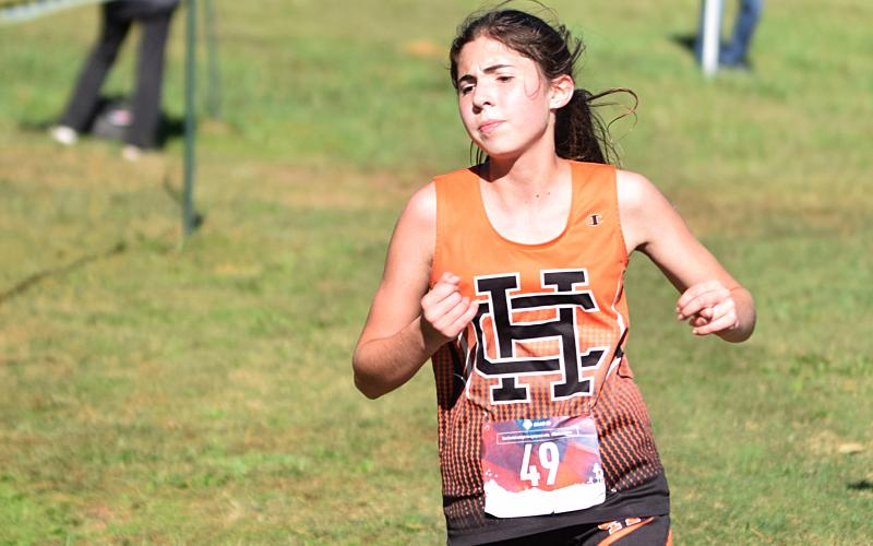 Hart County Runners Zachary Peters and Melody Blomberg run in the Region 8-AAA cross country meet last week.