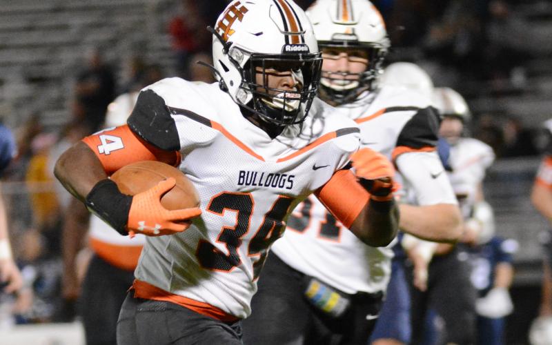 Sunshot by Michael Hall J.L. Lackey runs for a chunk of his 136 rushing yards on Nov. 13 against East Jackson in Commerce.