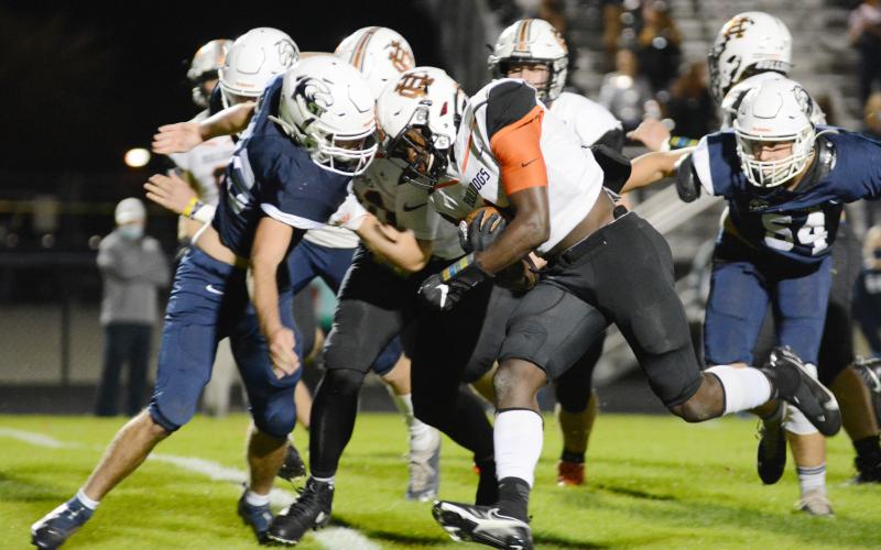 Sunshots by Michael Hall Hart County’s Malachi Thomas bulldozes his way through an East Jackson defender in Commerce on Nov. 13 in the Bulldogs’ region victory over the Eagles.