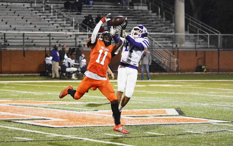 Paul Davis pulls an interception from the hands of a Monroe Area receiver.