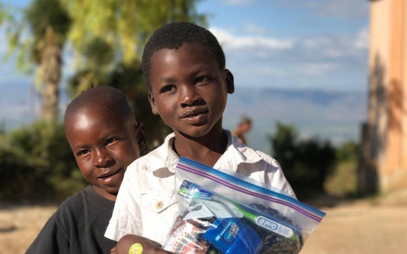 Photo submitted - Children in Haiti smile with their Joybags given to them by Love Him Love Them ministries during a trip to Haiti last holiday season.