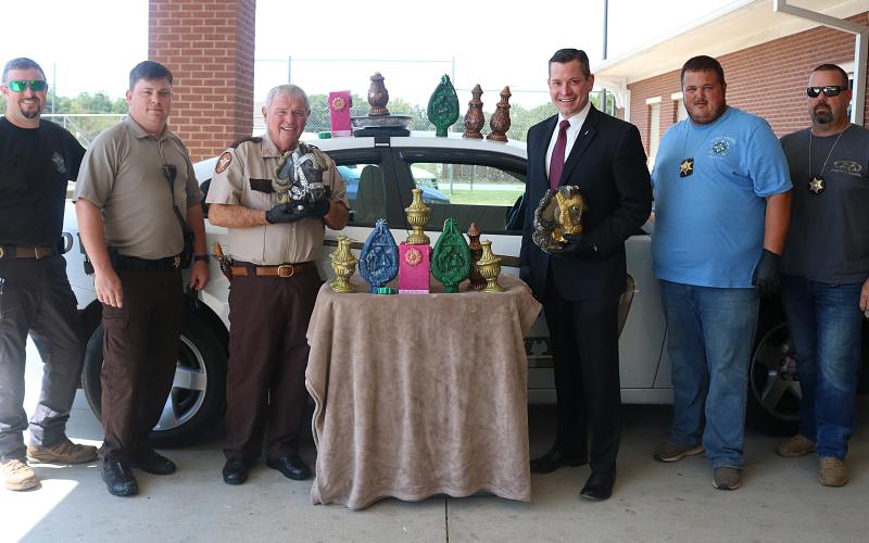 Pictured from left to right are, Inv. Chris Carroll, deputy Josh Fowler, Sheriff Mike Cleveland, District Attorney Parks White, Inv. Kevin White and Inv. Joseph Haley with 47 pounds of methamphetamine disguised as candles that were seized in September 2019.
