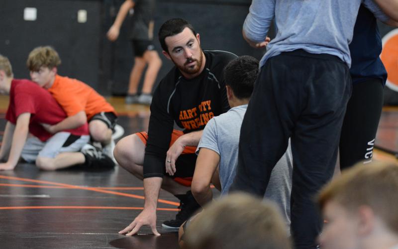Sunshot by Grayson Williams - Head coach Sean Gaddy coaches up a wrestler at practice on Thursday, Nov. 5 at Hart County High School.