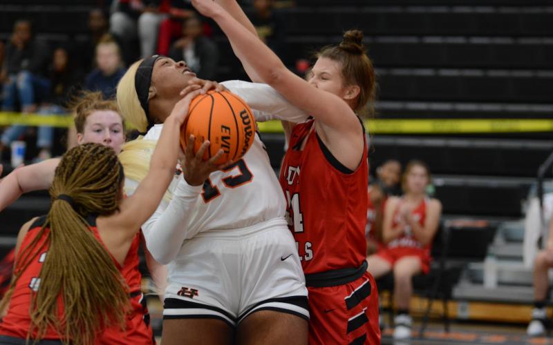 Sunshot by Grayson Williams - Taniya “Nesha” Alexander tries to power through Loganville defenders on Monday at Hart County High School during the McDonald’s Shootout. The Hart County Lady Dogs fell by one point on Tuesday in the semifinal game.